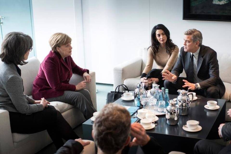 Ehepaar Clooney trifft Angela Merkel