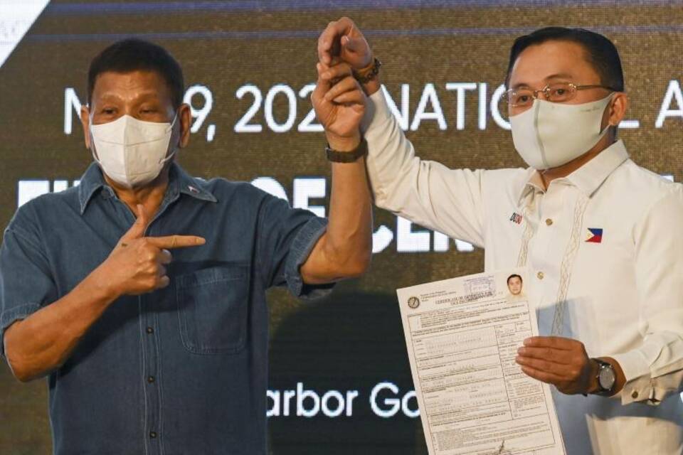 Rodrigo Duterte + Christopher Go