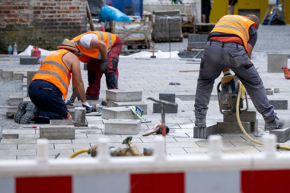 Arbeiter auf einer Baustelle Arbeiter auf einer Baustelle
