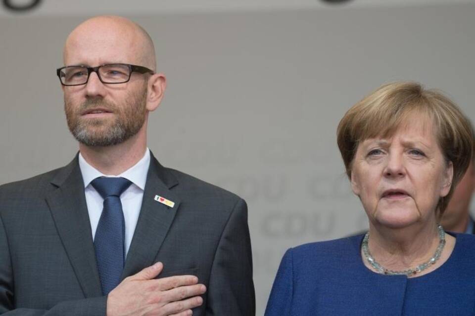Tauber und Merkel