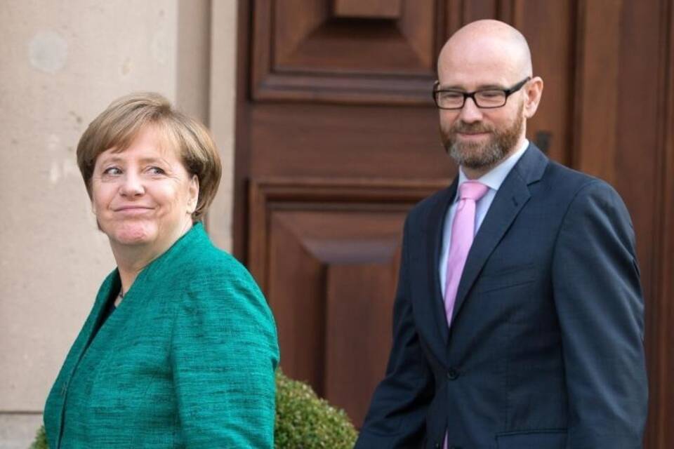 Tauber und Merkel