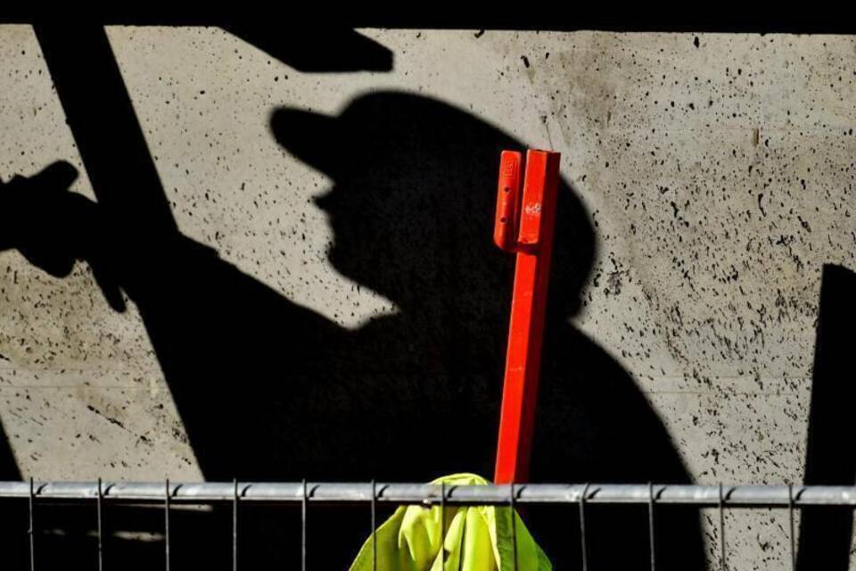 Schatten eines Arbeiters