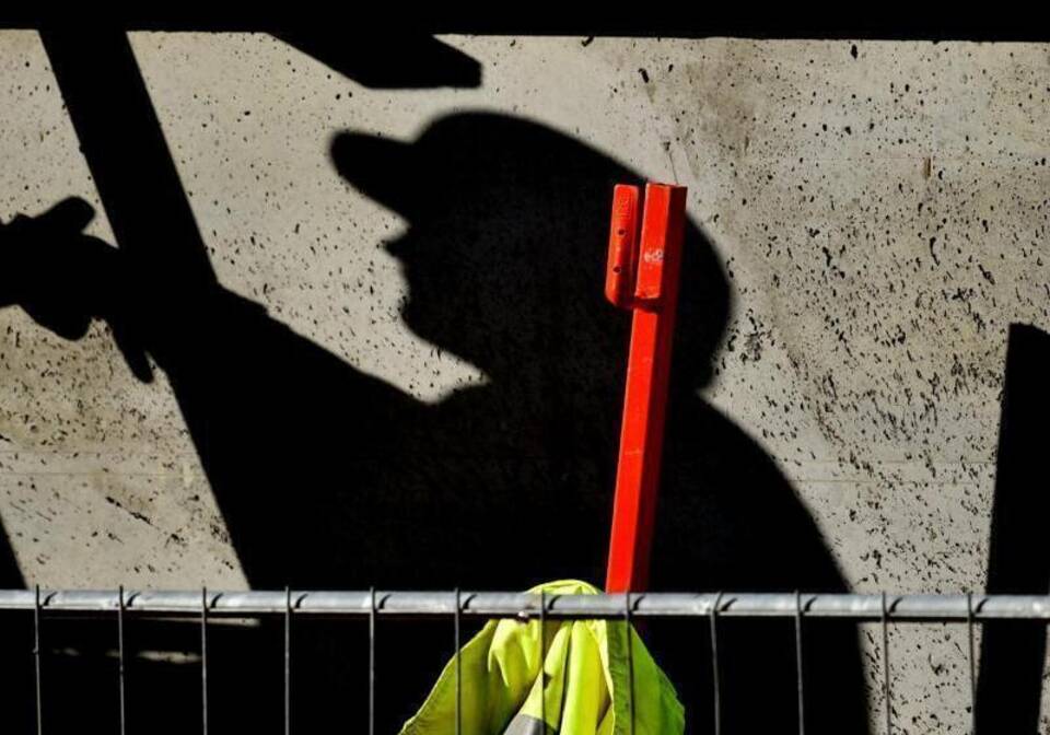 Schatten eines Arbeiters